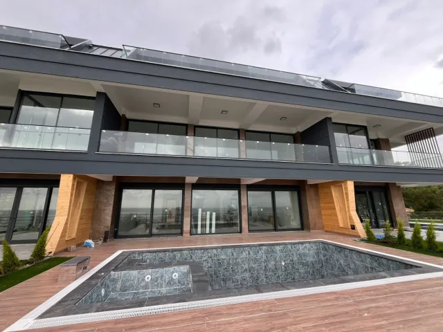 <p>Siberia Villas, situated in the picturesque Incekum District of Alanya, offer a luxurious living experience just 550 meters away from the serene sea.<br />
<br />
The project comprises three beautifully designed villas, each featuring its own private swimming pool.<br />
<br />
Additional amenities include an open car park, a spacious barbecue area, and well-maintained green spaces.<br />
<br />
The villas are available in two types: 4+2 villas, spanning 380 square meters, and a more spacious 5+2 villa with 460 square meters of living space.<br />
<br />
The construction of these magnificent homes is set to commence on May 30th, 2022, with an anticipated completion date of December 30th, 2023.</p>
