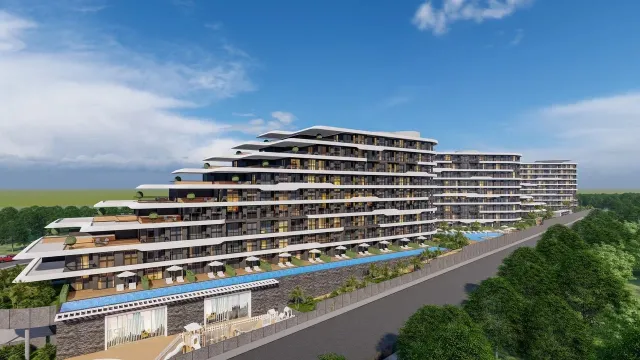 <p>MAGICAL WORLD OF LOVE Embrace the magic of our new collection inspired by love!<br />
Magical World Of Love, which will be a masterpiece of a new life that will touch not only the minds but also the hearts, has 2 separate facades with a total of 788 apartments. One side is with valley facade and the other side is with Altıntaş facade and the hill will be built at a point.<br />
<br />
Life Center, shopping malls, airport, proximity to the town square with rich social areas such as equipment, Irish pub, Starbucks coffee, Migros market, nursery, Restaurant, habitats, such as that incorporates ecofriendly with solar energy panels which we offer our collection will lead the future.<br />
<br />
It will be built on its own purchased land with a total area of 22,800 m2, which was purchased with the company's equity.<br />
<br />
The collection has a unique architecture with 10 floors designed by architect Adil Okur. There are a wide variety of apartment plans, some with a private Swim Up in the garden, some with terraces with a private pool.<br />
<br />
The complex, which will have its own beach in Lara region, will also have a Shuttle service to the Beach, Antalya International Airport and shopping malls such as Mall of Antalya, Deepo Outlet Center, Agora Shopping Center and Ikea for the Collection residents only.<br />
<br />
The construction of our Collection will start on 30.06.2024 and will be completed on 30.12.2026.<br />
<br />
Payment Plan In the contract, 50% of the sales price and the remaining 50% payment will be paid every 3 months until the Project delivery. Pay the remaining 50% of the payment will be paid every 3 months until the delivery of the Project.</p>

<p>&nbsp;</p>

<p>The total number of apartments in the collection is 788; 1+1 (50 &ndash; 61 &ndash; 62- 63.50 &ndash; 64 - 64.50 &ndash; 65 &ndash; 66 - 74.50 &ndash; 82 - 83.50 &ndash; 86 - 92.50 - 116.50 m2) 2+1 (71.50 &ndash; 73 &ndash; 86 &ndash; 87 &ndash; 90 &ndash; 90.50 &ndash; 91 &ndash; 93 &ndash; 93.50 &ndash; 95 &ndash; 95.50 &ndash; 98.50 &ndash; 99 &ndash; 100 &ndash; 102 &ndash; 107 &ndash; 114 &ndash; 115 &ndash; 120.50 &ndash; 122.50 &ndash; 126 -135 - 169 m2)<br />
<br />
Social Equipment:<br />
1.Lobby - Reception<br />
2.indoor parking<br />
3.Outdoor Parking<br />
4.Universal Car Charging Unit for Electric Vehicles<br />
5.Outdoor Swimming Pool (Adult and Child)<br />
6.Indoor Swimming Pool<br />
7.Spa (Turkısh Bath, Sauna, Fitness, Steam Room, Salt Room, Warmth, Massage Rooms and Vip Spa Room)<br />
8.Meeting Room and Library<br />
9.Solar Energy (50% of the energy used in social areas will be produced with Solar Panels.)<br />
10.Playgrounds (Bowling, Billiards, Darts, Foosball, Playstation, Cinema Hall)<br />
11.Pool Bar<br />
12.Barbecue Area<br />
13.Mini Club<br />
14.Children's Play Area<br />
15.Aquapark<br />
16.Hiking Trail<br />
17. Free Beach Entrance (VIP Card)<br />
18. Free Transfer (To the Beach, Airport and Shopping Centers)<br />
19.TV &amp; Satellite System<br />
20.7/24 Security &amp; Camera Systems<br />
<br />
Distance to Important Points;<br />
1.5 km from the airport<br />
Shopping Center (Mall Of,Deepo,Agora and Ikea) 4 km<br />
6 Km from Lara Beach<br />
<br />
Concierge Services;<br />
1.Guest Hospitality Services<br />
2.Dry Cleaning<br />
3.Housekeeping<br />
4.Carpet Washing<br />
5.Technical Service<br />
6.Vip Transfer<br />
7.Car Rental<br />
8.Courier Service<br />
9.Veterinary<br />
10.Doctor<br />
<br />
Building Features; 1.In accordance with the earthquake regulations 2.In accordance with the building inspection regulation 3.In accordance with the Fire Regulations 4.Ground Survey has been carried out 5.Generator 6.Air Conditioning Assembly Unit 7.8Pc Elevator 8.Quality Insulation 9.Mechanical exterior wall cladding Apartment Features; 1.Underfloor heating 2.Electric Boiler 3. 3-piece Kitchen Built-in set 4.Air Conditioners 5. Smart home system 6.Aluminum Systems for Doors and Windows 7.Kitchen, Bathroom and Cloakroom Cabinets (Lacquered Painted) 8.American Door (Lacquered Painted) 9.Floors 60x120 Ceramic or their counterparts 10.Shower cabin 11.Steel Door 12.Roller Shutter Box (ISO AND CE Certified productsin accordance with European Standards will be used.)</p>
