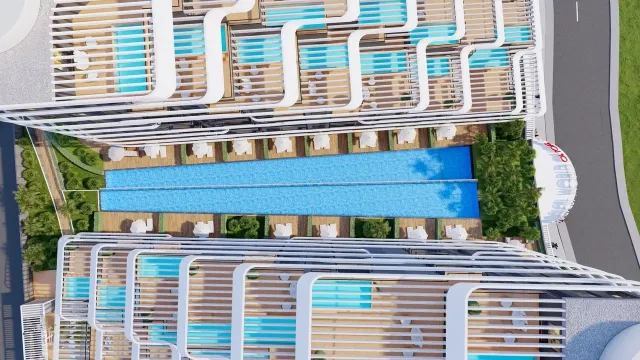 <p>MAGICAL WORLD OF LOVE Embrace the magic of our new collection inspired by love!<br />
Magical World Of Love, which will be a masterpiece of a new life that will touch not only the minds but also the hearts, has 2 separate facades with a total of 788 apartments. One side is with valley facade and the other side is with Altıntaş facade and the hill will be built at a point.<br />
<br />
Life Center, shopping malls, airport, proximity to the town square with rich social areas such as equipment, Irish pub, Starbucks coffee, Migros market, nursery, Restaurant, habitats, such as that incorporates ecofriendly with solar energy panels which we offer our collection will lead the future.<br />
<br />
It will be built on its own purchased land with a total area of 22,800 m2, which was purchased with the company's equity.<br />
<br />
The collection has a unique architecture with 10 floors designed by architect Adil Okur. There are a wide variety of apartment plans, some with a private Swim Up in the garden, some with terraces with a private pool.<br />
<br />
The complex, which will have its own beach in Lara region, will also have a Shuttle service to the Beach, Antalya International Airport and shopping malls such as Mall of Antalya, Deepo Outlet Center, Agora Shopping Center and Ikea for the Collection residents only.<br />
<br />
The construction of our Collection will start on 30.06.2024 and will be completed on 30.12.2026.<br />
<br />
Payment Plan In the contract, 50% of the sales price and the remaining 50% payment will be paid every 3 months until the Project delivery. Pay the remaining 50% of the payment will be paid every 3 months until the delivery of the Project.</p>

<p>&nbsp;</p>

<p>The total number of apartments in the collection is 788; 1+1 (50 &ndash; 61 &ndash; 62- 63.50 &ndash; 64 - 64.50 &ndash; 65 &ndash; 66 - 74.50 &ndash; 82 - 83.50 &ndash; 86 - 92.50 - 116.50 m2) 2+1 (71.50 &ndash; 73 &ndash; 86 &ndash; 87 &ndash; 90 &ndash; 90.50 &ndash; 91 &ndash; 93 &ndash; 93.50 &ndash; 95 &ndash; 95.50 &ndash; 98.50 &ndash; 99 &ndash; 100 &ndash; 102 &ndash; 107 &ndash; 114 &ndash; 115 &ndash; 120.50 &ndash; 122.50 &ndash; 126 -135 - 169 m2)<br />
<br />
Social Equipment:<br />
1.Lobby - Reception<br />
2.indoor parking<br />
3.Outdoor Parking<br />
4.Universal Car Charging Unit for Electric Vehicles<br />
5.Outdoor Swimming Pool (Adult and Child)<br />
6.Indoor Swimming Pool<br />
7.Spa (Turkısh Bath, Sauna, Fitness, Steam Room, Salt Room, Warmth, Massage Rooms and Vip Spa Room)<br />
8.Meeting Room and Library<br />
9.Solar Energy (50% of the energy used in social areas will be produced with Solar Panels.)<br />
10.Playgrounds (Bowling, Billiards, Darts, Foosball, Playstation, Cinema Hall)<br />
11.Pool Bar<br />
12.Barbecue Area<br />
13.Mini Club<br />
14.Children's Play Area<br />
15.Aquapark<br />
16.Hiking Trail<br />
17. Free Beach Entrance (VIP Card)<br />
18. Free Transfer (To the Beach, Airport and Shopping Centers)<br />
19.TV &amp; Satellite System<br />
20.7/24 Security &amp; Camera Systems<br />
<br />
Distance to Important Points;<br />
1.5 km from the airport<br />
Shopping Center (Mall Of,Deepo,Agora and Ikea) 4 km<br />
6 Km from Lara Beach<br />
<br />
Concierge Services;<br />
1.Guest Hospitality Services<br />
2.Dry Cleaning<br />
3.Housekeeping<br />
4.Carpet Washing<br />
5.Technical Service<br />
6.Vip Transfer<br />
7.Car Rental<br />
8.Courier Service<br />
9.Veterinary<br />
10.Doctor<br />
<br />
Building Features; 1.In accordance with the earthquake regulations 2.In accordance with the building inspection regulation 3.In accordance with the Fire Regulations 4.Ground Survey has been carried out 5.Generator 6.Air Conditioning Assembly Unit 7.8Pc Elevator 8.Quality Insulation 9.Mechanical exterior wall cladding Apartment Features; 1.Underfloor heating 2.Electric Boiler 3. 3-piece Kitchen Built-in set 4.Air Conditioners 5. Smart home system 6.Aluminum Systems for Doors and Windows 7.Kitchen, Bathroom and Cloakroom Cabinets (Lacquered Painted) 8.American Door (Lacquered Painted) 9.Floors 60x120 Ceramic or their counterparts 10.Shower cabin 11.Steel Door 12.Roller Shutter Box (ISO AND CE Certified productsin accordance with European Standards will be used.)</p>
