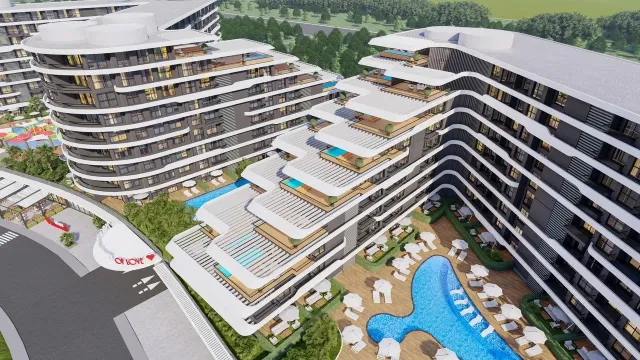 <p>MAGICAL WORLD OF LOVE Embrace the magic of our new collection inspired by love!<br />
Magical World Of Love, which will be a masterpiece of a new life that will touch not only the minds but also the hearts, has 2 separate facades with a total of 788 apartments. One side is with valley facade and the other side is with Altıntaş facade and the hill will be built at a point.<br />
<br />
Life Center, shopping malls, airport, proximity to the town square with rich social areas such as equipment, Irish pub, Starbucks coffee, Migros market, nursery, Restaurant, habitats, such as that incorporates ecofriendly with solar energy panels which we offer our collection will lead the future.<br />
<br />
It will be built on its own purchased land with a total area of 22,800 m2, which was purchased with the company's equity.<br />
<br />
The collection has a unique architecture with 10 floors designed by architect Adil Okur. There are a wide variety of apartment plans, some with a private Swim Up in the garden, some with terraces with a private pool.<br />
<br />
The complex, which will have its own beach in Lara region, will also have a Shuttle service to the Beach, Antalya International Airport and shopping malls such as Mall of Antalya, Deepo Outlet Center, Agora Shopping Center and Ikea for the Collection residents only.<br />
<br />
The construction of our Collection will start on 30.06.2024 and will be completed on 30.12.2026.<br />
<br />
Payment Plan In the contract, 50% of the sales price and the remaining 50% payment will be paid every 3 months until the Project delivery. Pay the remaining 50% of the payment will be paid every 3 months until the delivery of the Project.</p>

<p>&nbsp;</p>

<p>The total number of apartments in the collection is 788; 1+1 (50 &ndash; 61 &ndash; 62- 63.50 &ndash; 64 - 64.50 &ndash; 65 &ndash; 66 - 74.50 &ndash; 82 - 83.50 &ndash; 86 - 92.50 - 116.50 m2) 2+1 (71.50 &ndash; 73 &ndash; 86 &ndash; 87 &ndash; 90 &ndash; 90.50 &ndash; 91 &ndash; 93 &ndash; 93.50 &ndash; 95 &ndash; 95.50 &ndash; 98.50 &ndash; 99 &ndash; 100 &ndash; 102 &ndash; 107 &ndash; 114 &ndash; 115 &ndash; 120.50 &ndash; 122.50 &ndash; 126 -135 - 169 m2)<br />
<br />
Social Equipment:<br />
1.Lobby - Reception<br />
2.indoor parking<br />
3.Outdoor Parking<br />
4.Universal Car Charging Unit for Electric Vehicles<br />
5.Outdoor Swimming Pool (Adult and Child)<br />
6.Indoor Swimming Pool<br />
7.Spa (Turkısh Bath, Sauna, Fitness, Steam Room, Salt Room, Warmth, Massage Rooms and Vip Spa Room)<br />
8.Meeting Room and Library<br />
9.Solar Energy (50% of the energy used in social areas will be produced with Solar Panels.)<br />
10.Playgrounds (Bowling, Billiards, Darts, Foosball, Playstation, Cinema Hall)<br />
11.Pool Bar<br />
12.Barbecue Area<br />
13.Mini Club<br />
14.Children's Play Area<br />
15.Aquapark<br />
16.Hiking Trail<br />
17. Free Beach Entrance (VIP Card)<br />
18. Free Transfer (To the Beach, Airport and Shopping Centers)<br />
19.TV &amp; Satellite System<br />
20.7/24 Security &amp; Camera Systems<br />
<br />
Distance to Important Points;<br />
1.5 km from the airport<br />
Shopping Center (Mall Of,Deepo,Agora and Ikea) 4 km<br />
6 Km from Lara Beach<br />
<br />
Concierge Services;<br />
1.Guest Hospitality Services<br />
2.Dry Cleaning<br />
3.Housekeeping<br />
4.Carpet Washing<br />
5.Technical Service<br />
6.Vip Transfer<br />
7.Car Rental<br />
8.Courier Service<br />
9.Veterinary<br />
10.Doctor<br />
<br />
Building Features; 1.In accordance with the earthquake regulations 2.In accordance with the building inspection regulation 3.In accordance with the Fire Regulations 4.Ground Survey has been carried out 5.Generator 6.Air Conditioning Assembly Unit 7.8Pc Elevator 8.Quality Insulation 9.Mechanical exterior wall cladding Apartment Features; 1.Underfloor heating 2.Electric Boiler 3. 3-piece Kitchen Built-in set 4.Air Conditioners 5. Smart home system 6.Aluminum Systems for Doors and Windows 7.Kitchen, Bathroom and Cloakroom Cabinets (Lacquered Painted) 8.American Door (Lacquered Painted) 9.Floors 60x120 Ceramic or their counterparts 10.Shower cabin 11.Steel Door 12.Roller Shutter Box (ISO AND CE Certified productsin accordance with European Standards will be used.)</p>
