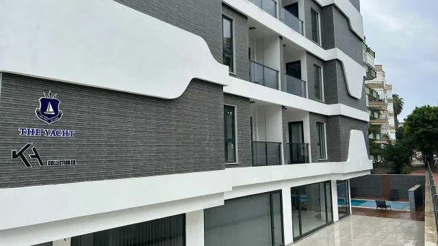 <p>THE YACHT RESIDENCE</p>

<p>The land of our project, located on Island 2844, Plot 2, in the center of Alanya, has an area of 1023.26 m&sup2;.</p>

<p>Our project consists of 6 floors, 1 Block, and 50 independent sections. There are 10 1+1 flats on each floor.</p>

<p>is taking.</p>

<p>Flat qualities of the project:</p>

<p>8 Pieces of 1+1 Studio Flat 38.5 m&sup2;- 1 Balcony, 1 Bathroom</p>

<p>32 1+1 Flats 47 m&sup2;-47.5 m&sup2; - 1 Balcony, 1 Bathroom</p>

<p>Apartment Interior Technical Specifications:</p>

<p>Built-in kitchen countertops and furniture cabinets, plumbing and ceramic floors in the kitchen and bathroom coating, PVC double glass windows and balcony doors, 1st Class flat steel doors and security locks, modern lacquered painted panel doors, 1st Class plastic interior wall and ceiling paintings, ceiling areas hidden LED lighting, Class 1 ceramic coatings on the floors, heat-resistant, fireproof electrical installation, switches and sockets, internet and television installations, automatic ventilation system in bathrooms Intercom door security systems in the flats, infrastructure of the air conditioners are based on the central system. planned.</p>

<p>Apartment Exterior Technical Specifications:</p>

<p>Its exterior architecture symbolizes the yacht. The exterior consists of mechanical cladding.</p>
