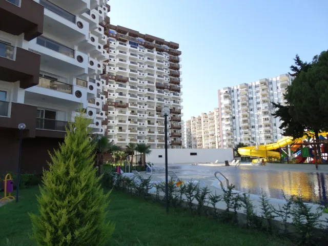 <p><strong>Project Name:Liparsi Sunset (Arpa&ccedil;bahşiş)</strong></p>

<p><strong>Our project, which is established on 7.956.91 M2 Green area, consists of 2 blocks and 196 apartments.&nbsp;Our project has 16 floors and there are 6-8 apartments on each floor.</strong></p>

<p><strong>Outdoor Features</strong></p>

<p><strong>∙&nbsp;&nbsp;&nbsp;&nbsp;&nbsp;&nbsp;&nbsp;&nbsp;Central Satellite</strong></p>

<p><strong>∙&nbsp;&nbsp;&nbsp;&nbsp;&nbsp;&nbsp;&nbsp;&nbsp;Central Solar Water Heater</strong></p>

<p><strong>∙&nbsp;&nbsp;&nbsp;&nbsp;&nbsp;&nbsp;&nbsp;&nbsp;Fully Equipped Generator</strong></p>

<p><strong>∙&nbsp;&nbsp;&nbsp;&nbsp;&nbsp;&nbsp;&nbsp;&nbsp;Outdoor Car Park</strong></p>

<p><strong>∙&nbsp;&nbsp;&nbsp;&nbsp;&nbsp;&nbsp;&nbsp;&nbsp;Photocell Building Entrance</strong></p>

<p><strong>∙&nbsp;&nbsp;&nbsp;&nbsp;&nbsp;&nbsp;&nbsp;&nbsp;Full Automatic 2 Elevators</strong></p>

<p><strong>Interior Features</strong></p>

<p><strong>∙&nbsp;&nbsp;&nbsp;&nbsp;&nbsp;&nbsp;&nbsp;&nbsp;Apartments 1+1 - 73/75 M2 / 2+1-95/105 M2</strong></p>

<p><strong>∙&nbsp;&nbsp;&nbsp;&nbsp;&nbsp;&nbsp;&nbsp;&nbsp;Air Conditioning Installation Collection Area</strong></p>

<p><strong>∙&nbsp;&nbsp;&nbsp;&nbsp;&nbsp;&nbsp;&nbsp;&nbsp;Entrance Door Steel Door</strong></p>

<p><strong>∙&nbsp;&nbsp;&nbsp;&nbsp;&nbsp;&nbsp;&nbsp;&nbsp;Special Design Cloakroom</strong></p>

<p><strong>∙&nbsp;&nbsp;&nbsp;&nbsp;&nbsp;&nbsp;&nbsp;&nbsp;Special Design Interior Doors</strong></p>

<p><strong>∙&nbsp;&nbsp;&nbsp;&nbsp;&nbsp;&nbsp;&nbsp;&nbsp;Wet Floors 1st Class Ceramic and Granite</strong></p>

<p><strong>∙&nbsp;&nbsp;&nbsp;&nbsp;&nbsp;&nbsp;&nbsp;&nbsp;Pvc Joinery (Double Glass-Insulating Glass)</strong></p>

<p><strong>∙&nbsp;&nbsp;&nbsp;&nbsp;&nbsp;&nbsp;&nbsp;&nbsp;Interior Doors Special Design</strong></p>

<p><strong>∙&nbsp;&nbsp;&nbsp;&nbsp;&nbsp;&nbsp;&nbsp;&nbsp;Space-Appropriate MDF Kitchen Cabinets</strong></p>

<p><strong>∙&nbsp;&nbsp;&nbsp;&nbsp;&nbsp;&nbsp;&nbsp;&nbsp;Granite Countertops</strong></p>

<p><strong>∙&nbsp;&nbsp;&nbsp;&nbsp;&nbsp;&nbsp;&nbsp;&nbsp;Custom Design Laundry Cabinet</strong></p>

<p><strong>∙&nbsp;&nbsp;&nbsp;&nbsp;&nbsp;&nbsp;&nbsp;&nbsp;2 Pcs Special Design Bathroom Cabinet</strong></p>

<p><strong>∙&nbsp;&nbsp;&nbsp;&nbsp;&nbsp;&nbsp;&nbsp;&nbsp;General Wc General Bathroom And En-Suite Bathroom</strong></p>

<p><strong>∙&nbsp;&nbsp;&nbsp;&nbsp;&nbsp;&nbsp;&nbsp;&nbsp;Shower</strong></p>

<p><strong>∙&nbsp;&nbsp;&nbsp;&nbsp;&nbsp;&nbsp;&nbsp;&nbsp;Chrome Balcony Railings Glass Plated Square Handrail</strong></p>

<p><strong>Social Areas</strong></p>

<p><strong>∙&nbsp;&nbsp;&nbsp;&nbsp;&nbsp;&nbsp;&nbsp;&nbsp;Outdoor Fitness</strong></p>

<p><strong>∙&nbsp;&nbsp;&nbsp;&nbsp;&nbsp;&nbsp;&nbsp;&nbsp;Outdoor Pool</strong></p>

<p><strong>∙&nbsp;&nbsp;&nbsp;&nbsp;&nbsp;&nbsp;&nbsp;&nbsp;Aqua Park</strong></p>

<p><strong>∙&nbsp;&nbsp;&nbsp;&nbsp;&nbsp;&nbsp;&nbsp;&nbsp;Camellias</strong></p>

<p><strong>∙&nbsp;&nbsp;&nbsp;&nbsp;&nbsp;&nbsp;&nbsp;&nbsp;BBQ Areas</strong></p>

<p><strong>∙&nbsp;&nbsp;&nbsp;&nbsp;&nbsp;&nbsp;&nbsp;&nbsp;Children's Playground</strong></p>

<p><strong>∙&nbsp;&nbsp;&nbsp;&nbsp;&nbsp;&nbsp;&nbsp;&nbsp;Jogging Paths</strong></p>

<p><strong>Security Features</strong></p>

<p><strong>∙&nbsp;&nbsp;&nbsp;&nbsp;&nbsp;&nbsp;&nbsp;&nbsp;Earthquake Regulation</strong></p>

<p><strong>∙&nbsp;&nbsp;&nbsp;&nbsp;&nbsp;&nbsp;&nbsp;&nbsp;7/24 Private Security</strong></p>

<p><strong>∙&nbsp;&nbsp;&nbsp;&nbsp;&nbsp;&nbsp;&nbsp;&nbsp;Fotoselli Site Entrance Gate</strong></p>

<p><strong>∙&nbsp;&nbsp;&nbsp;&nbsp;&nbsp;&nbsp;&nbsp;&nbsp;Bored pile</strong></p>

<p><strong>∙&nbsp;&nbsp;&nbsp;&nbsp;&nbsp;&nbsp;&nbsp;&nbsp;Fire Escapes</strong></p>

<p><strong>∙&nbsp;&nbsp;&nbsp;&nbsp;&nbsp;&nbsp;&nbsp;&nbsp;Central Camera System</strong></p>

<p><br />
&nbsp;</p>
